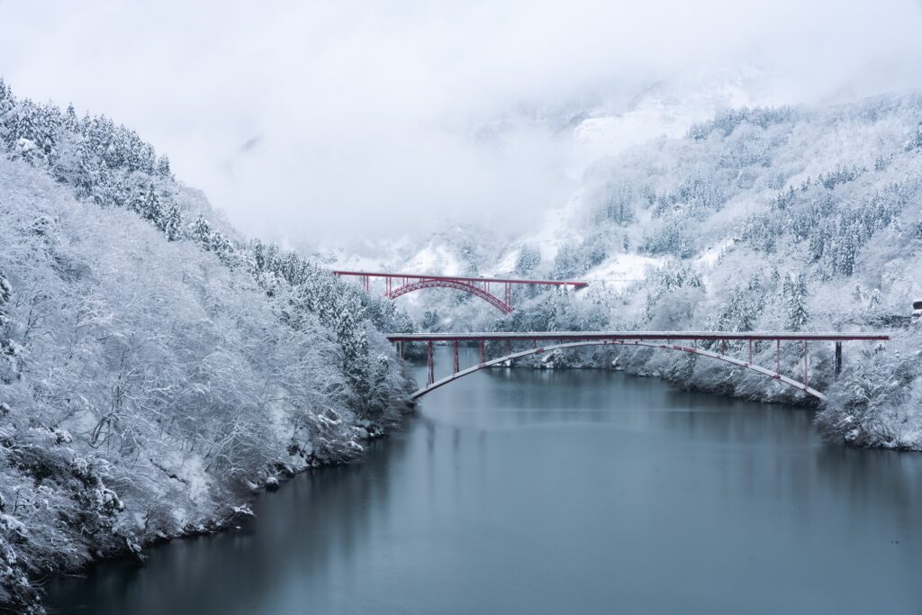 Red Bridge Over Shokawa Gorge River In Toyama Prefecture, Japan