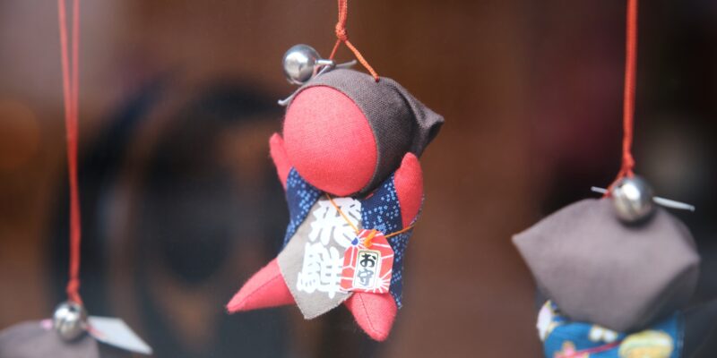 Sarubobo doll, Japanese amulet, in the town of Takayama in Gifu, Japan.